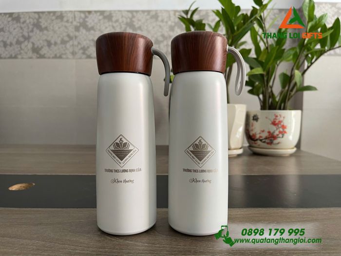 Bình Giữ Nhiệt Màu Trắng Nắp Vân Gỗ - Khắc Logo THCS Lương Định Của