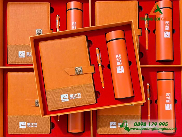 Bộ Quà Tặng (Sổ+ Bình+ Bút) Cao Cấp Màu Cam In Khắc Logo Doanh Nghiệp Luxshare ICT