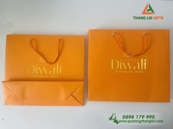 Túi xách giấy couche màu cam ép kim màu vàng logo DIWALI